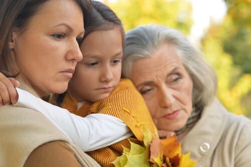 Family hugging before mother goes to treatment for her substance abuse