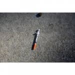 Needle used for drugs laying on sidewalk