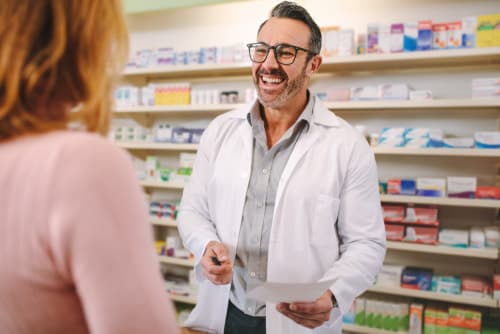 pharmacist speaking to patient about southern California harm reduction services