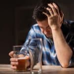 sad man facing alcoholism
