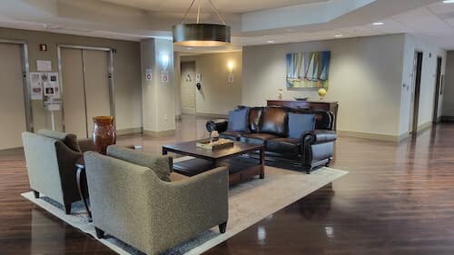 waiting area with sofa and chairs